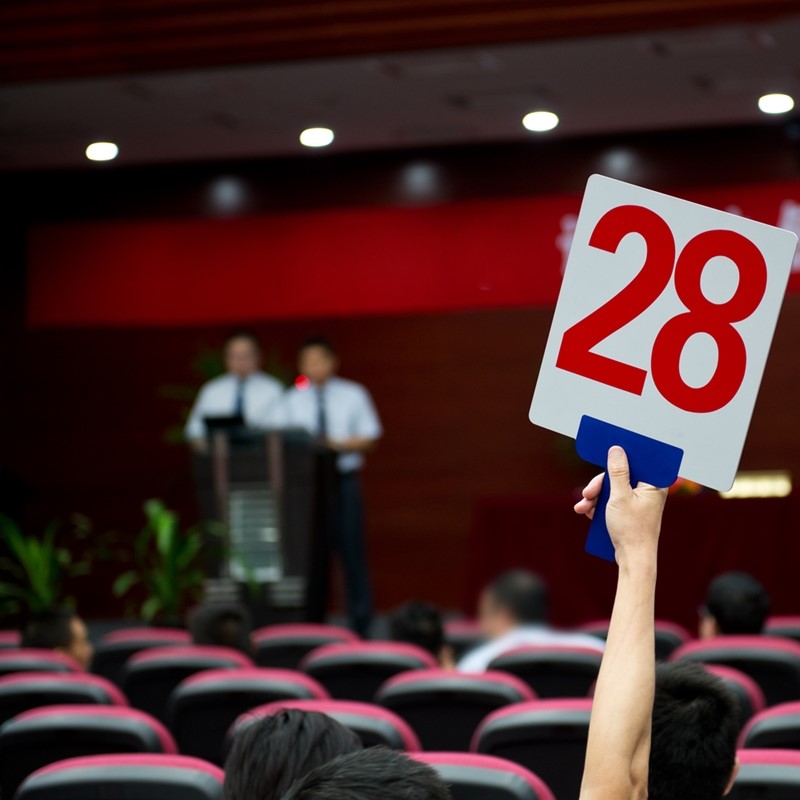 In-person auctions have different results than their online counterparts.