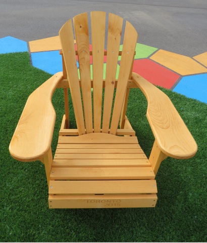 This Muskoka chair made by The Bear Chair Company, constructed with natural wood and stamped with TO ...